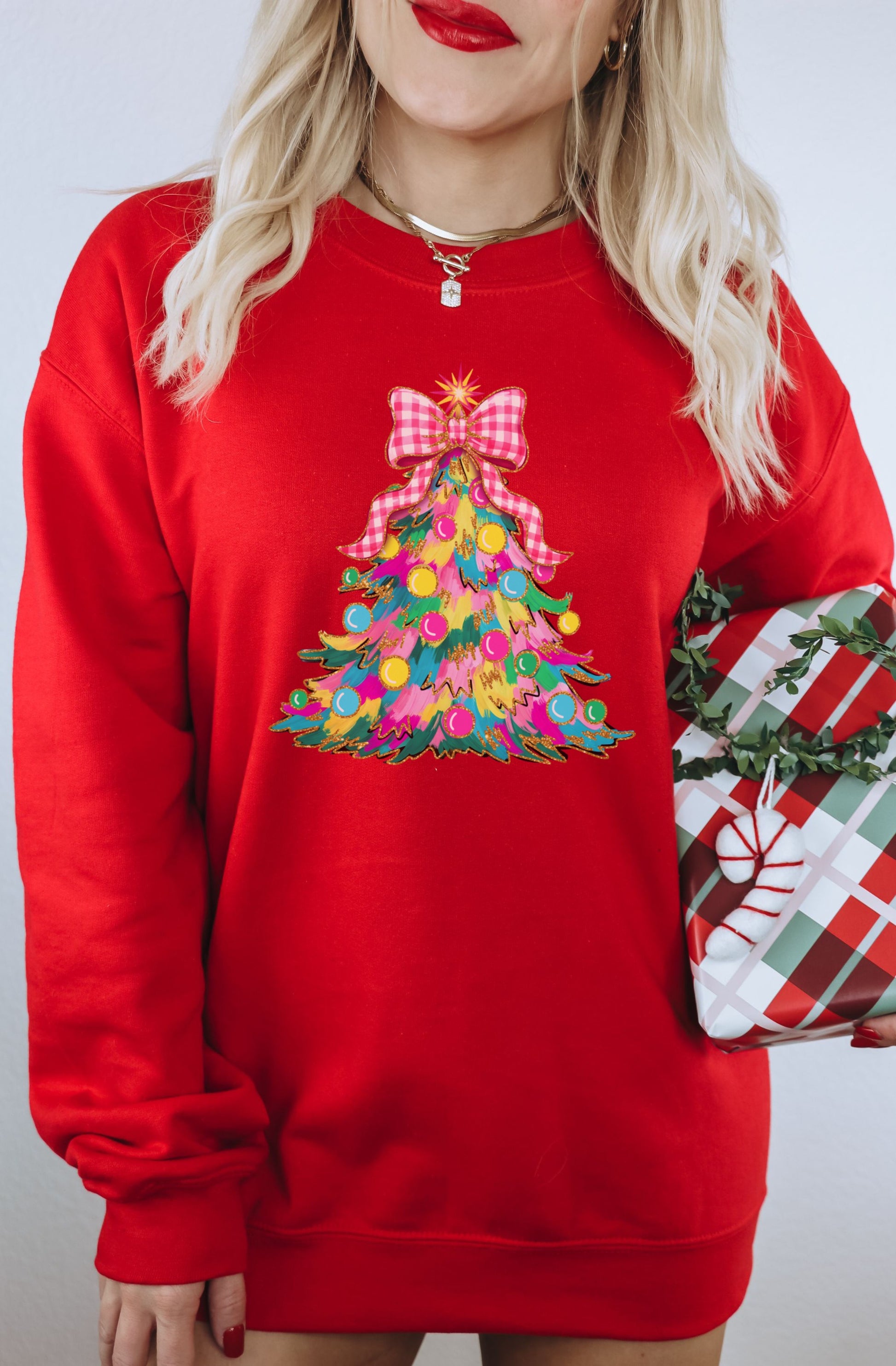 Festive Red Sweatshirt with Colorful Christmas Tree Design