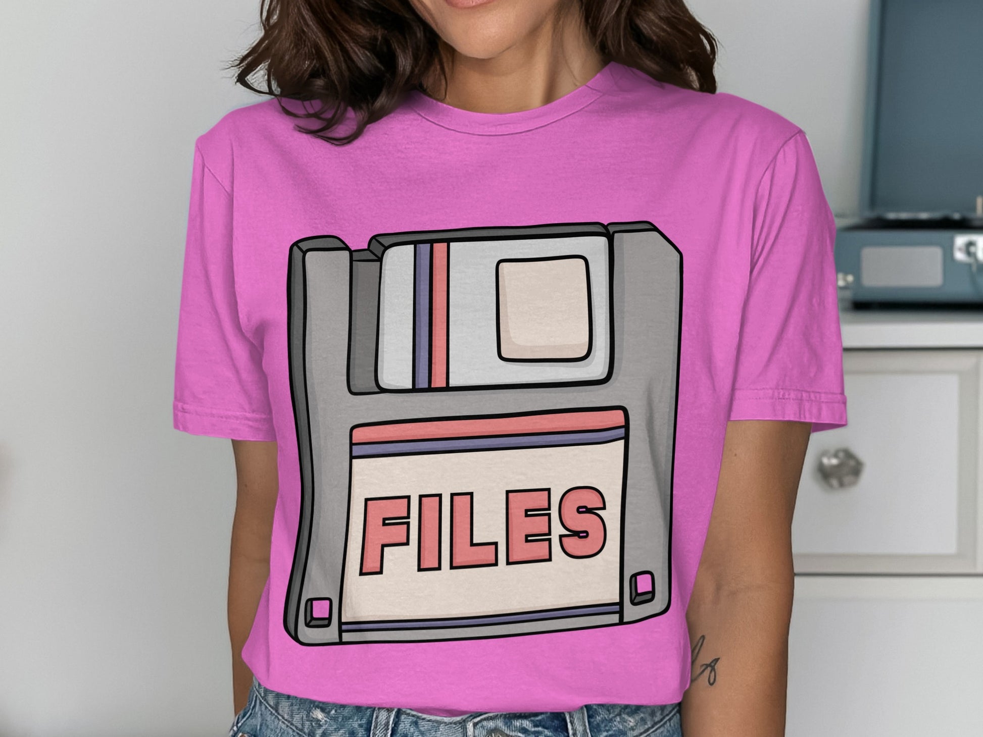 Retro Floppy Disk Artwork on Vibrant Pink Clothing