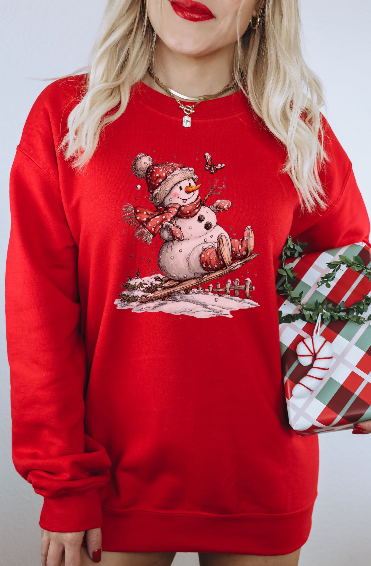 Cute Snowman on a Sled Red Christmas Sweatshirt