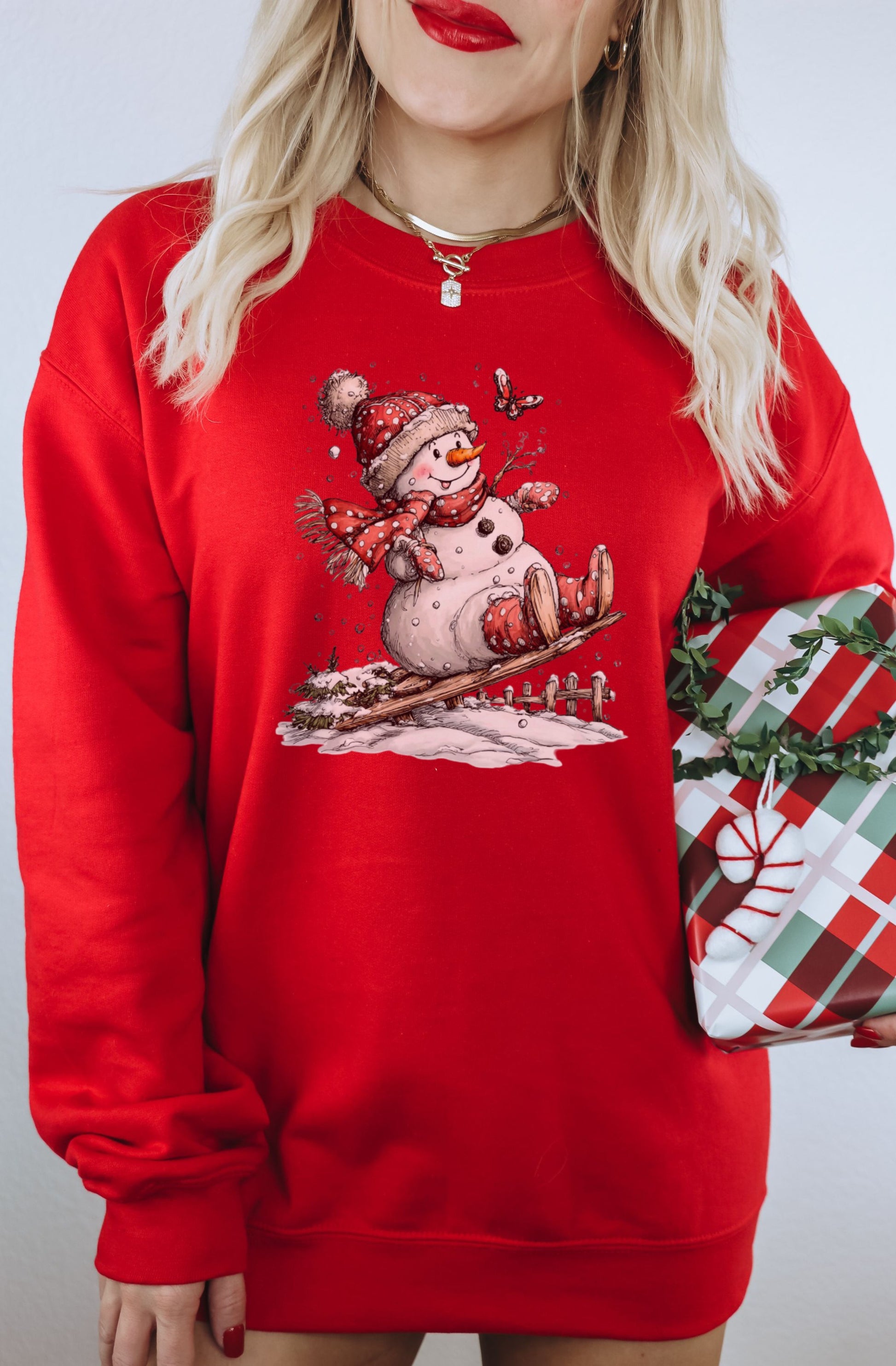 Cute Snowman on a Sled Red Christmas Sweatshirt