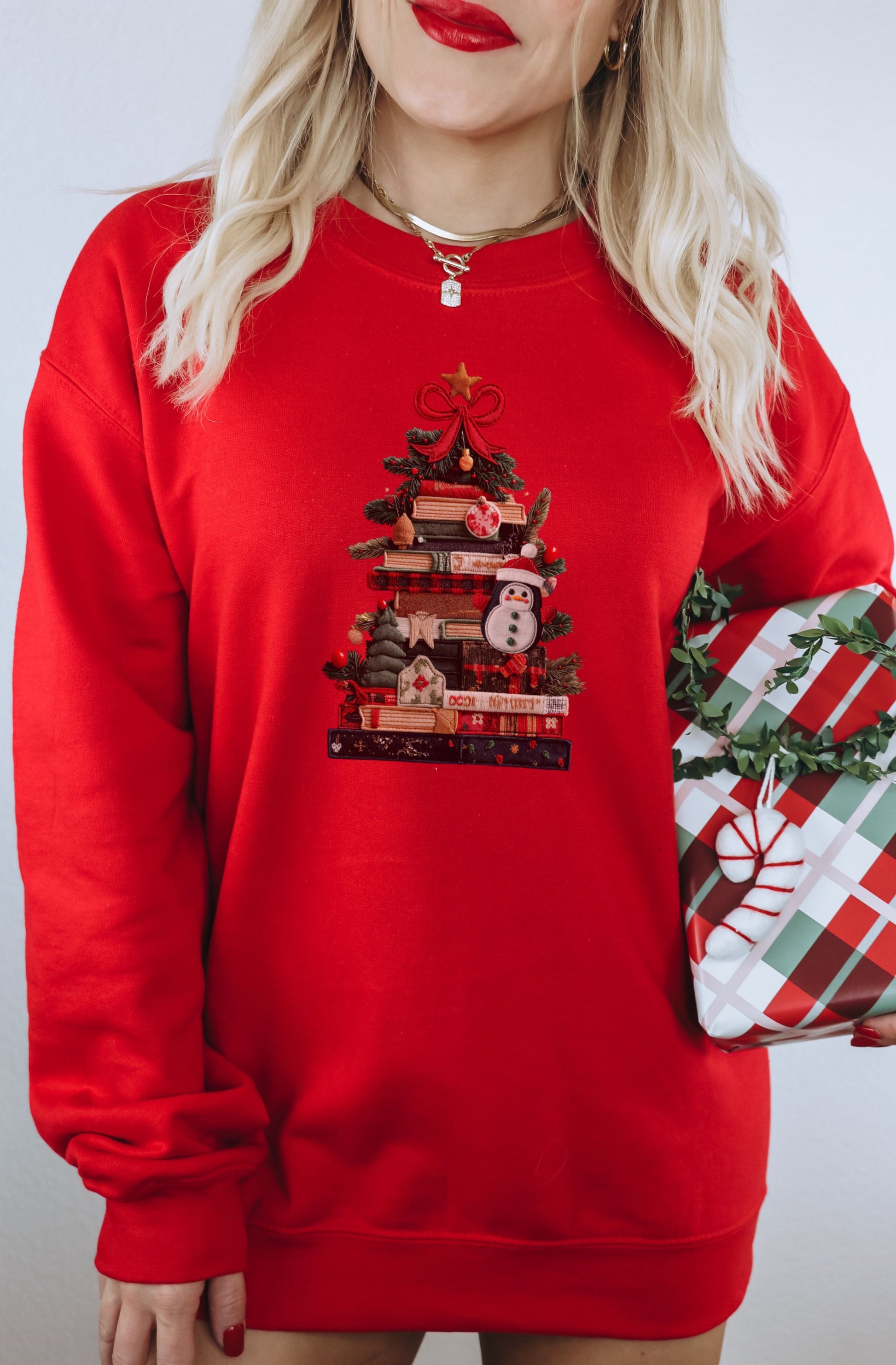 Festive Red Sweatshirt with Book Tree and Snowman Design