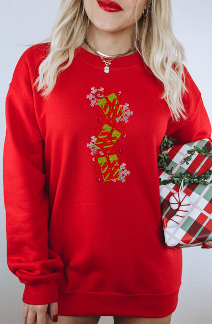 Vibrant red festive sweatshirt with floral details