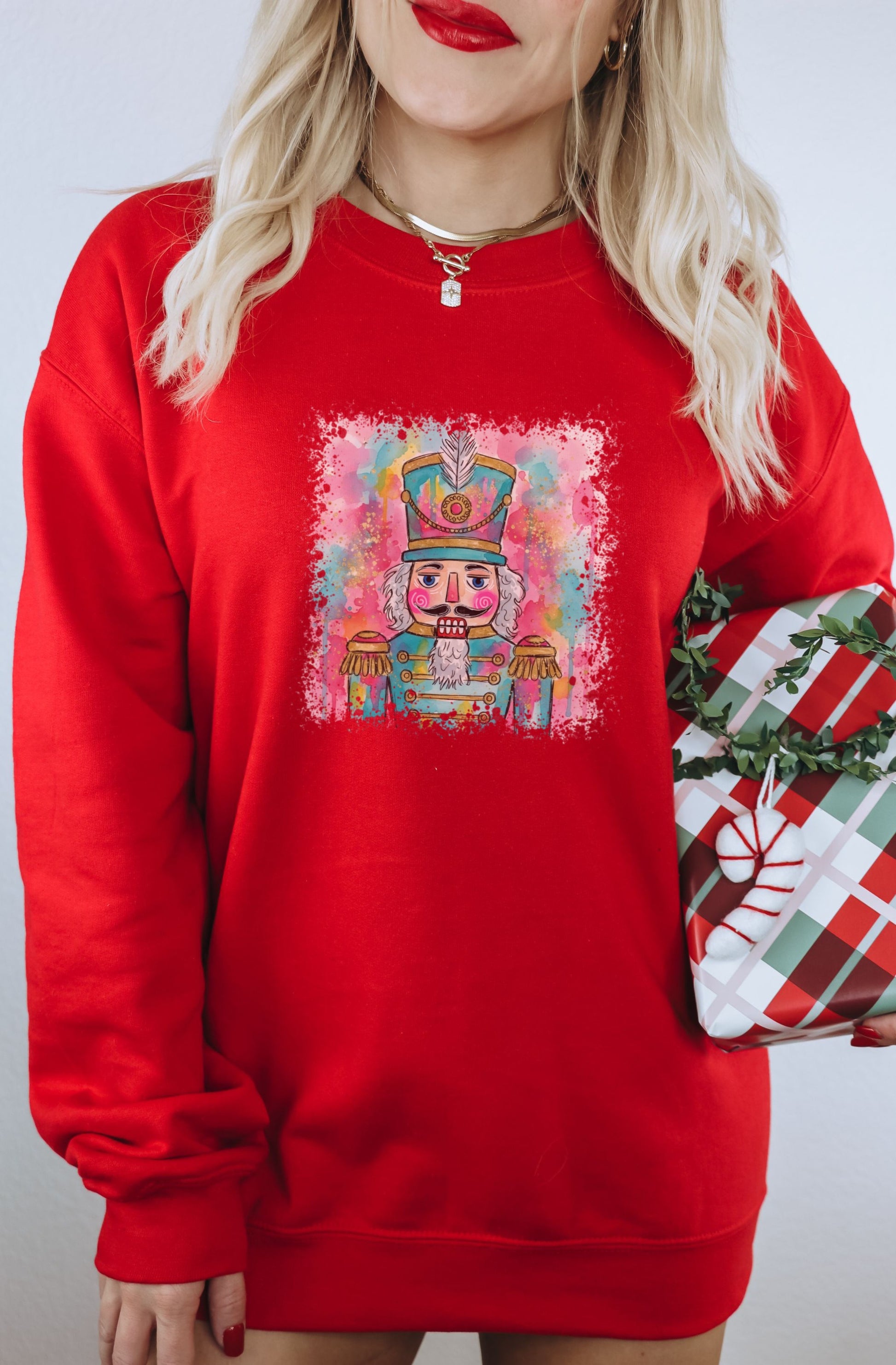 Vibrant Nutcracker Graphic Red Sweater for Festive Season
