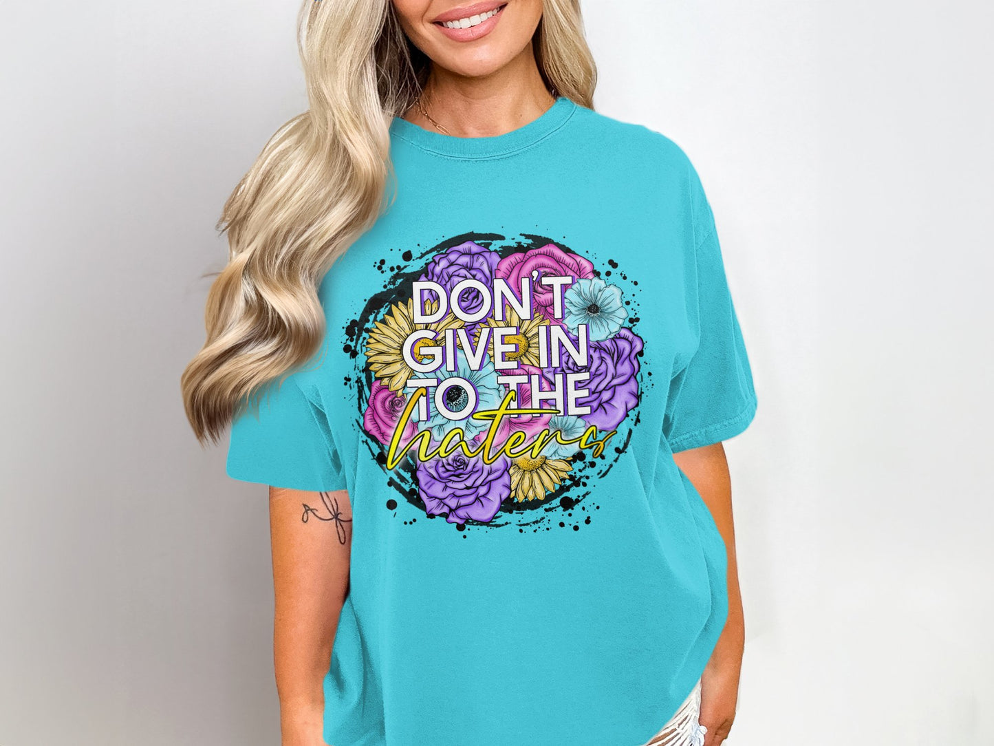 Don't Give In To The Haters Graphic Tee Product